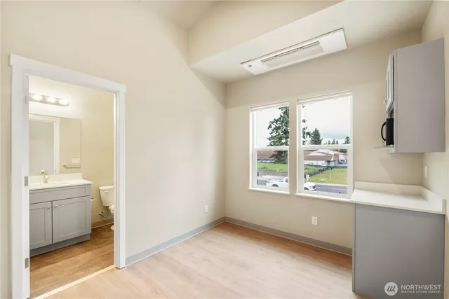 a view of an empty room with a window