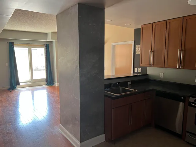 a kitchen with sink and window
