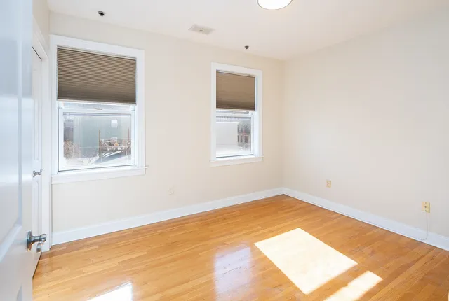 a view of a big room with windows