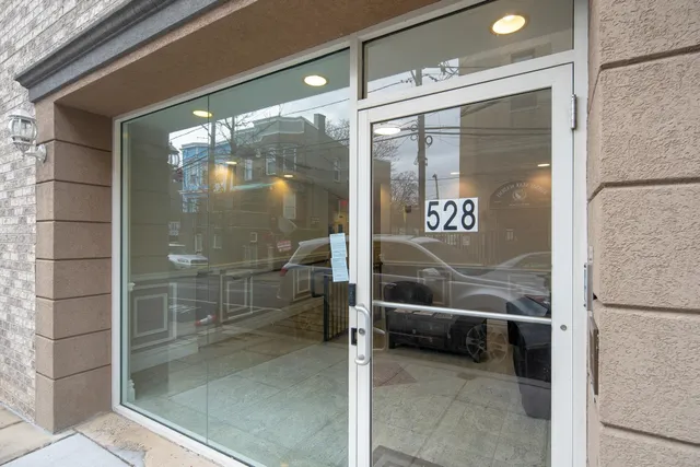 a glass door with a glass door and shower