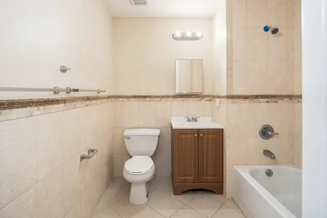 a bathroom with a toilet and a bathtub