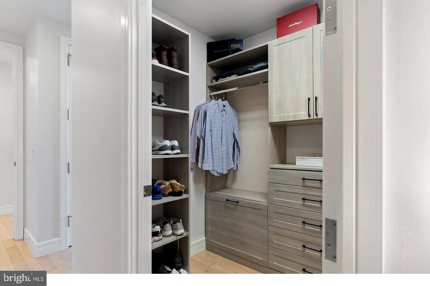 1414 South Penn Square, Unit 7F Philadelphia, PA 19102 - Photo 20 of 30 a view of walk in closet with clothes and shoes