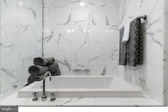 a bathroom with a glass shower door