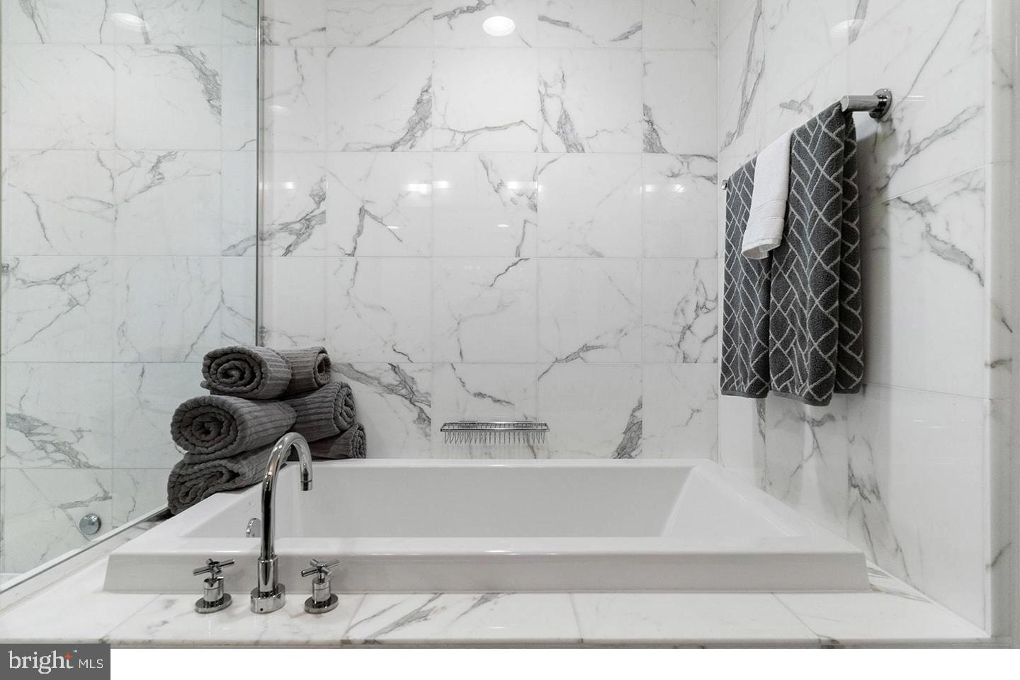 1414 South Penn Square, Unit 7F Philadelphia, PA 19102 - Photo 21 of 30 a bathroom with a bathtub and a shower