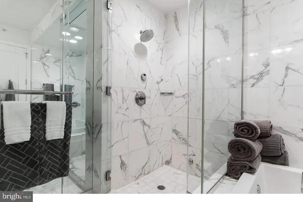 a bathroom with a sink double vanity and a mirror