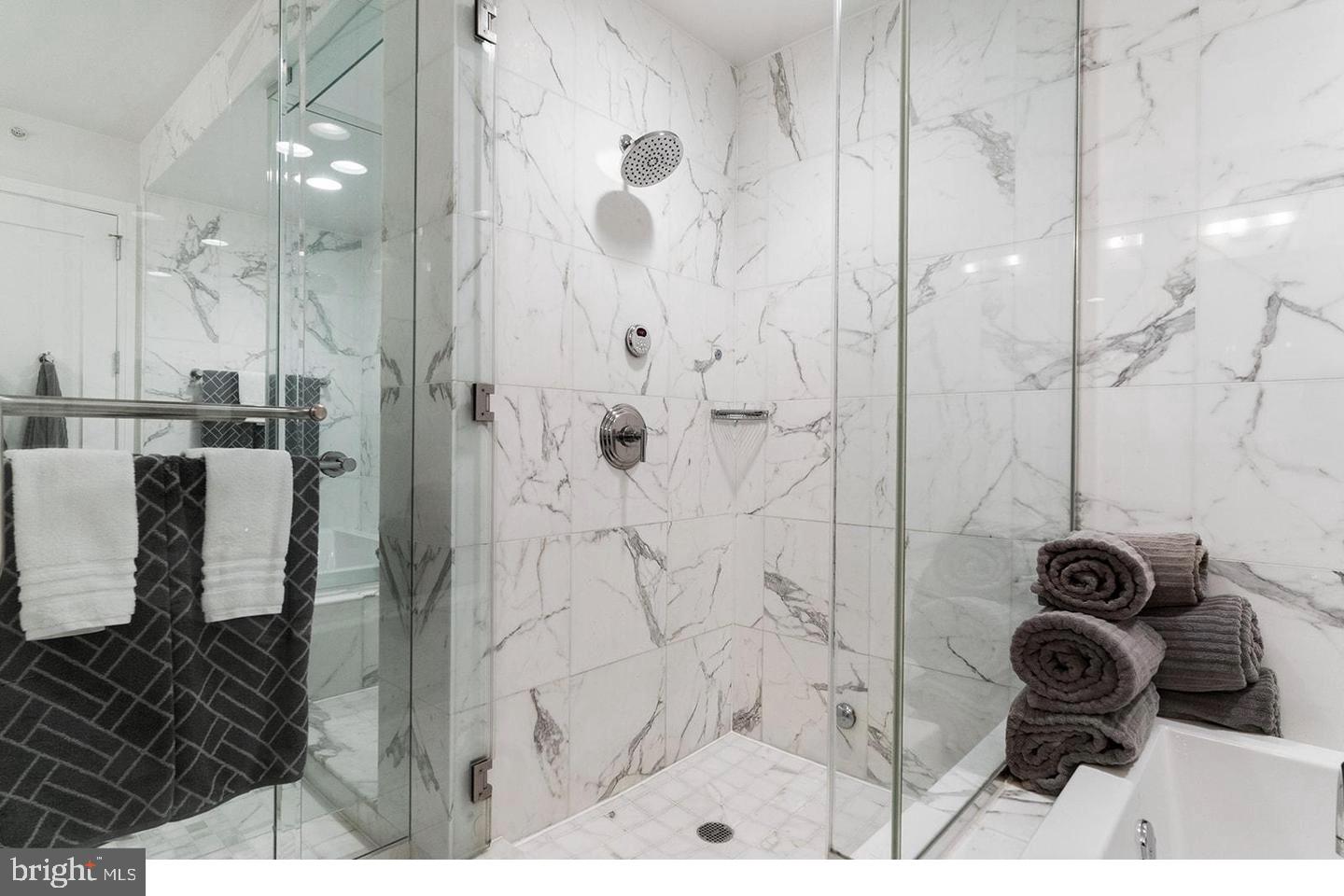 1414 South Penn Square, Unit 7F Philadelphia, PA 19102 - Photo 22 of 30 a bathroom with a glass shower door