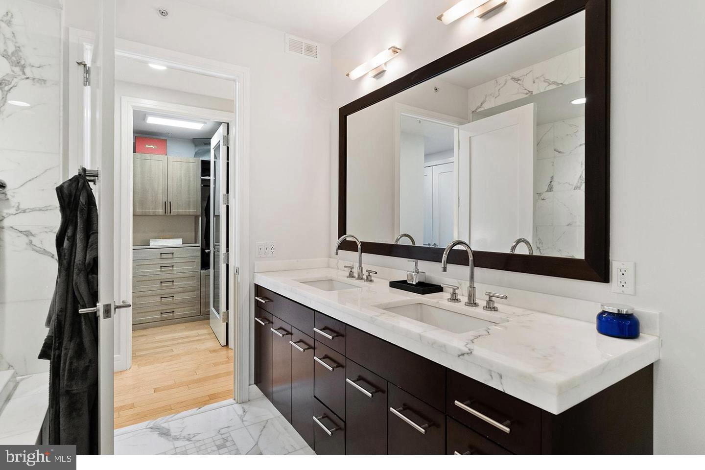 1414 South Penn Square, Unit 7F Philadelphia, PA 19102 - Photo 24 of 30 a bathroom with a sink double vanity and a mirror