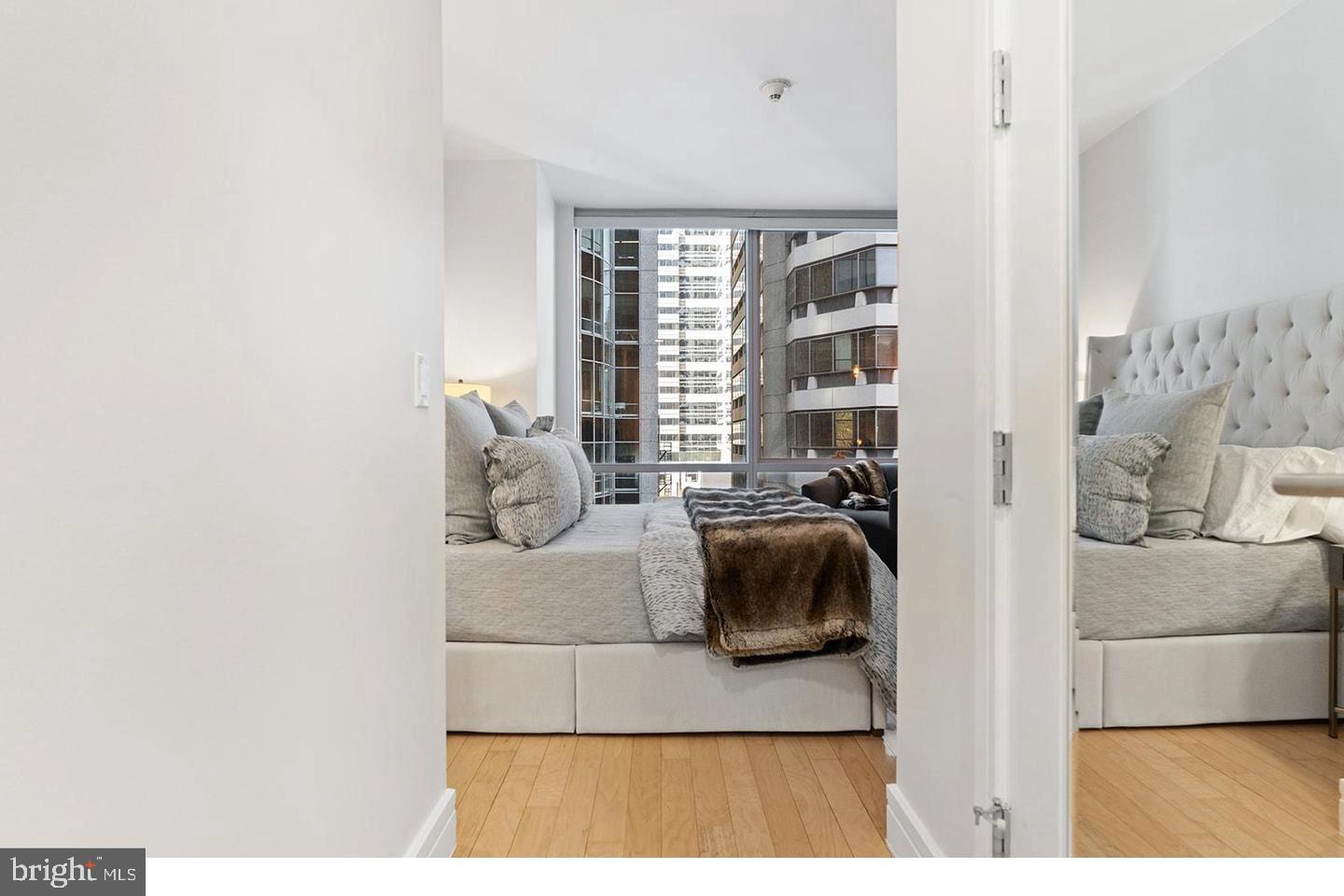 1414 South Penn Square, Unit 7F Philadelphia, PA 19102 - Photo 25 of 30 a living room with furniture and a window