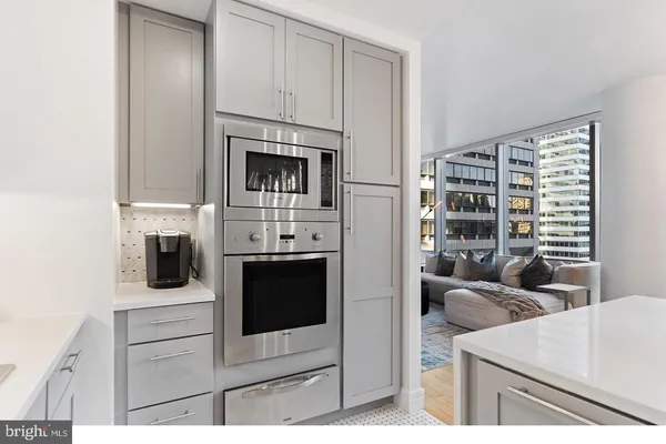 a kitchen with cabinets and a stove
