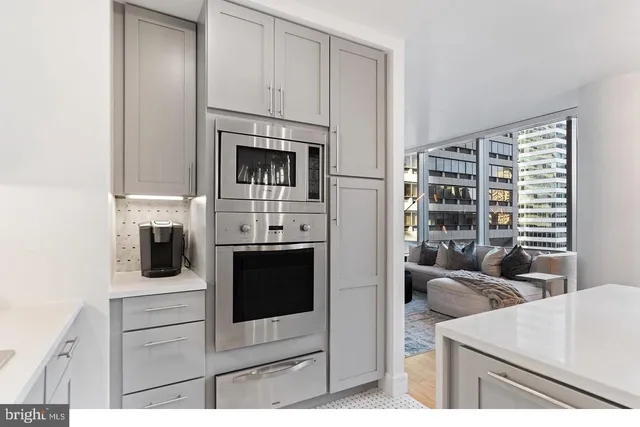 a kitchen with cabinets and a stove