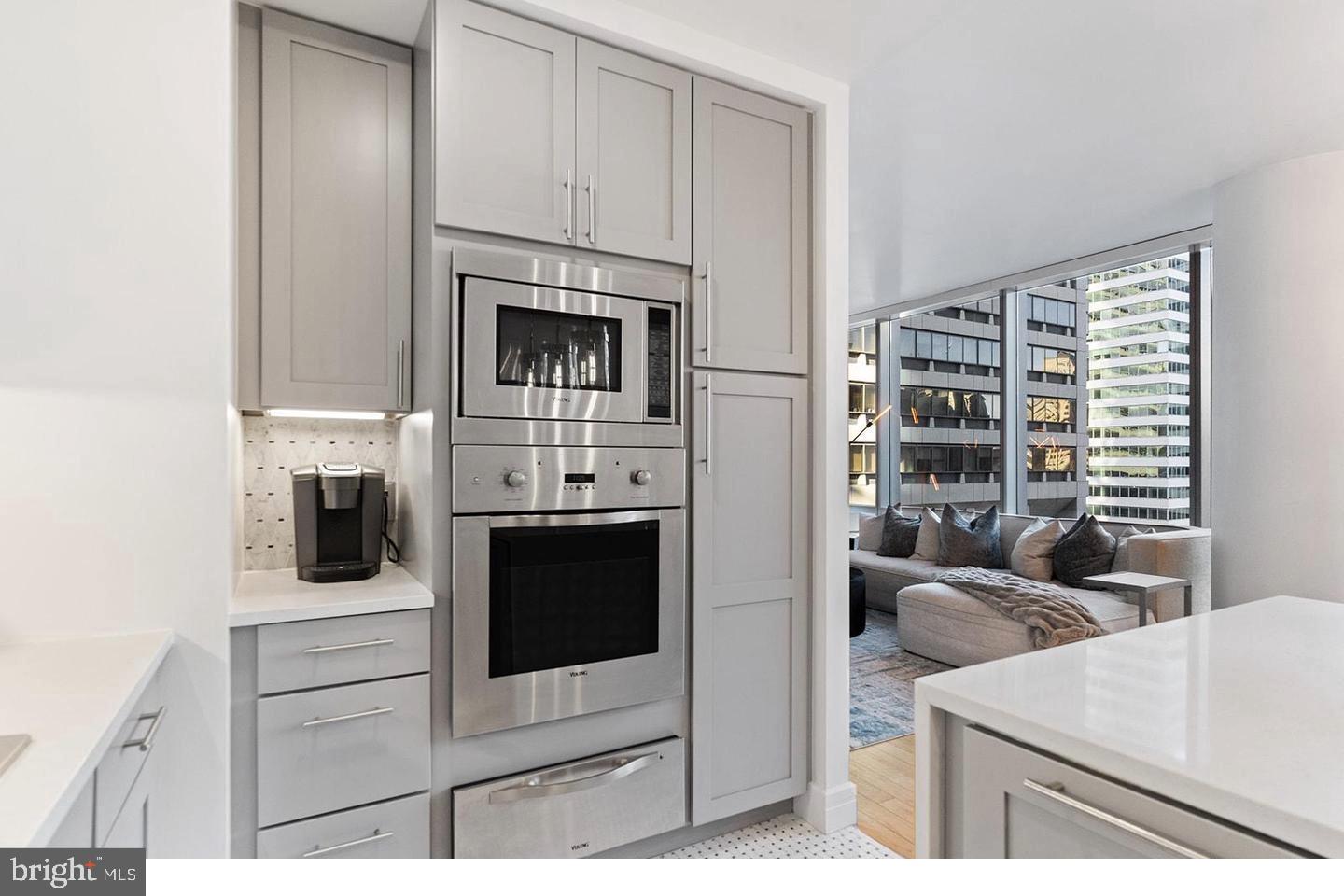 1414 South Penn Square, Unit 7F Philadelphia, PA 19102 - Photo 8 of 30 a kitchen with cabinets and a stove
