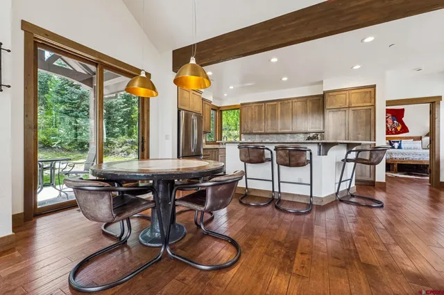 a view of a dining room with furniture window and wooden floor