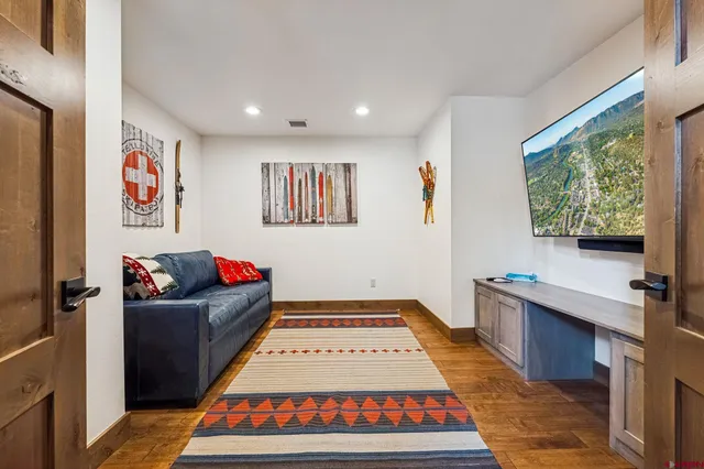 a living room with furniture and a rug
