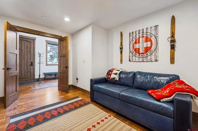a living room with furniture and a rug