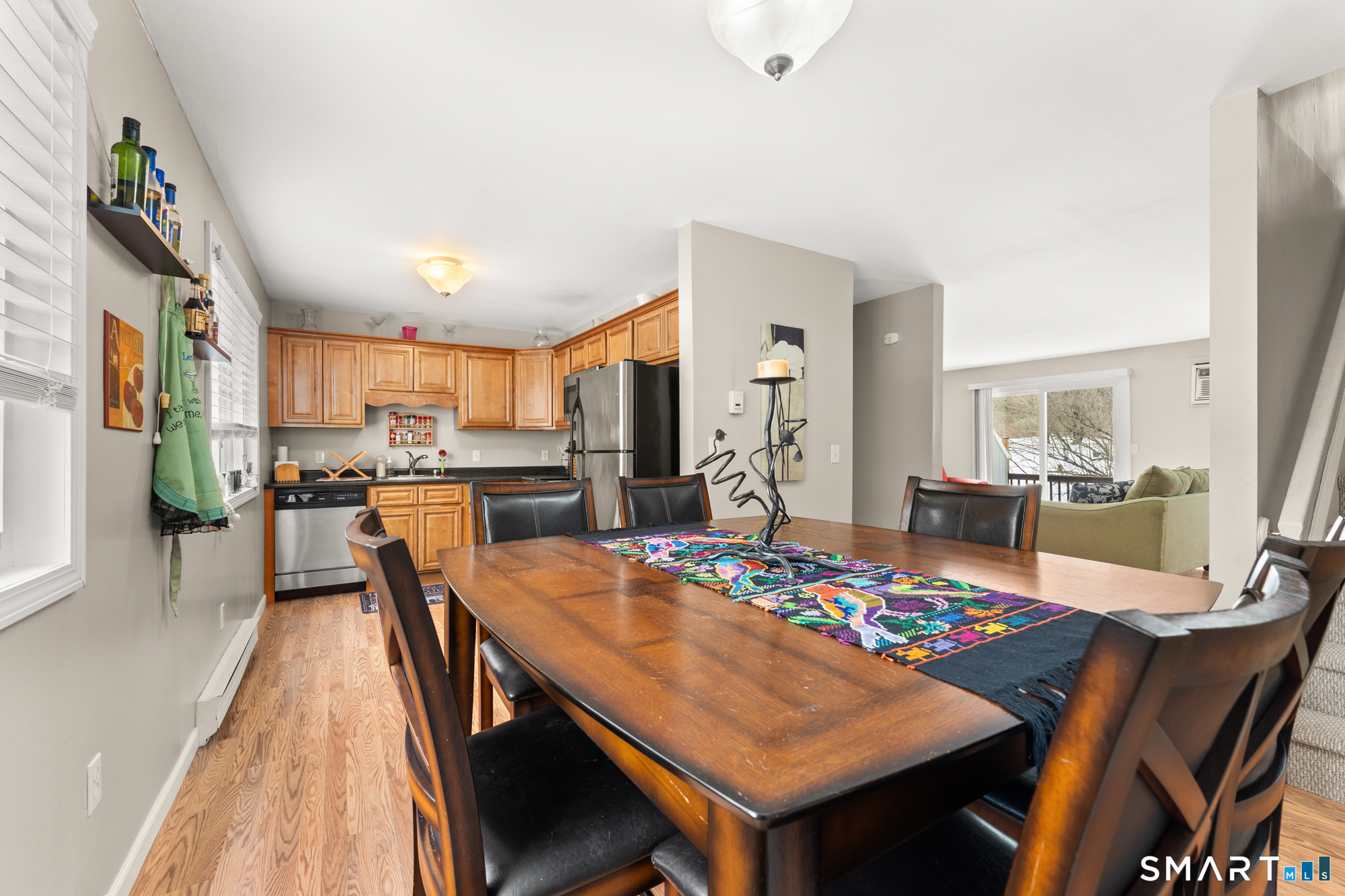 a view of a dining room kitchen and a table