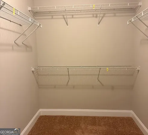 a view of a room with racks on the wall