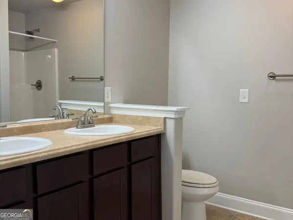 a bathroom with a sink toilet and vanity