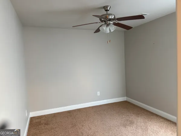 a view of a room with a fan