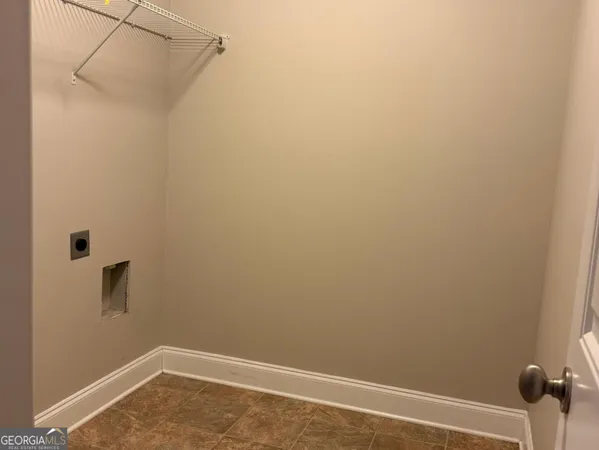 a view of a small space with racks on the wall