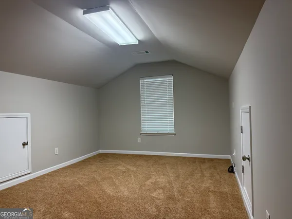 an empty room with a natural light