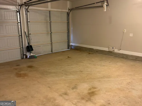 an empty room with a wooden walls