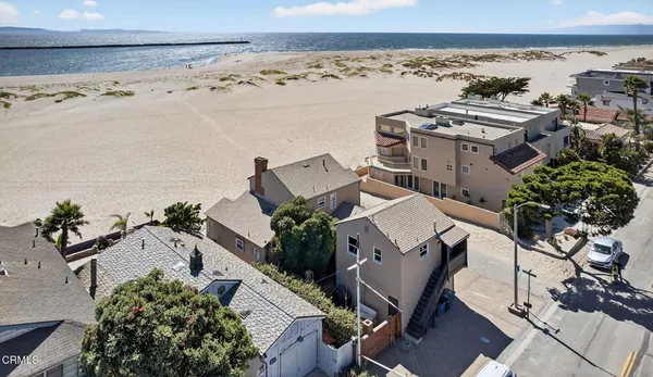 an aerial view of multiple houses with outdoor space