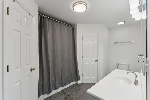 a bathroom with a tub and sink