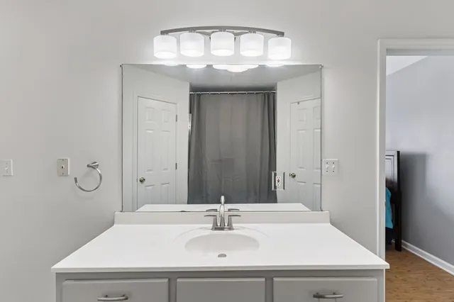 a bathroom with a sink and a mirror