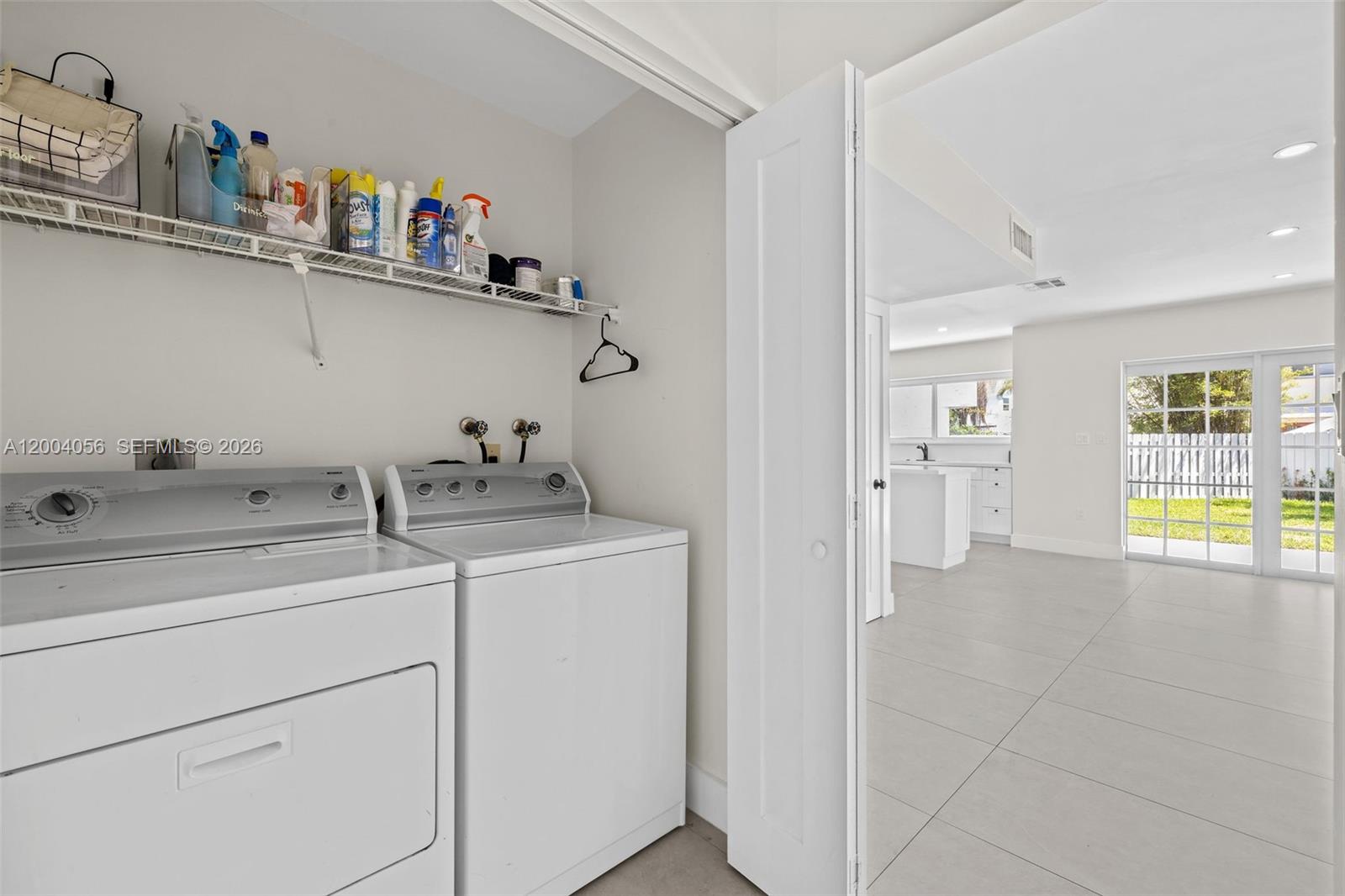 9547 Southwest 146th Place Miami, FL 33186 - Photo 18 of 40 a view of storage and utility room with washer and dryer