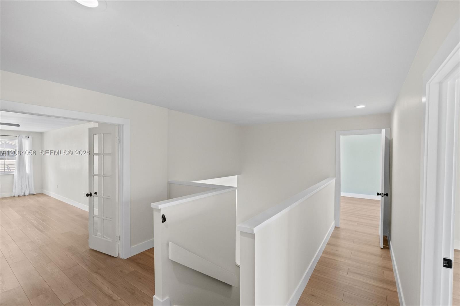 9547 Southwest 146th Place Miami, FL 33186 - Photo 19 of 40 a view of a hallway with wooden floor and closet