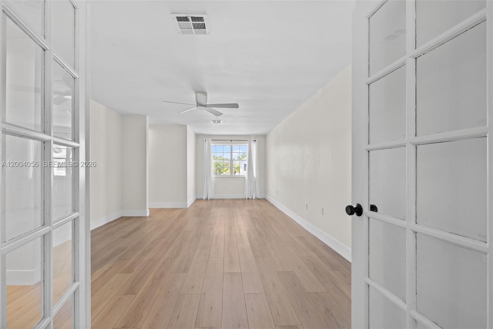 9547 Southwest 146th Place Miami, FL 33186 - Photo 20 of 40 a view of an empty room with a window