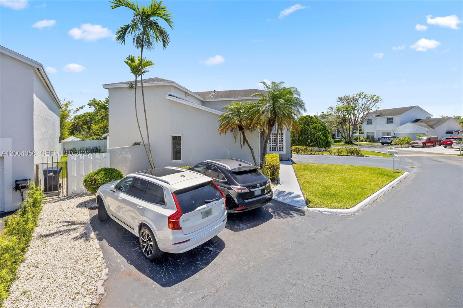 9547 Southwest 146th Place Miami, FL 33186 - Photo 2 of 40 a swimming pool with outdoor seating and yard