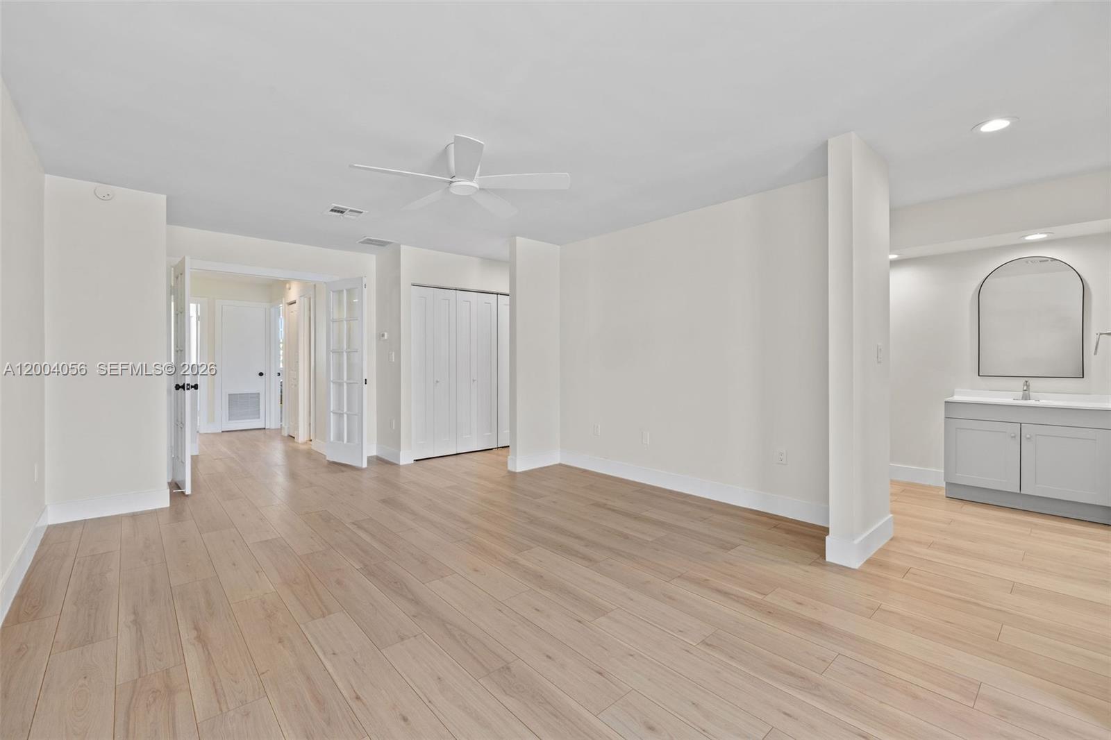 9547 Southwest 146th Place Miami, FL 33186 - Photo 22 of 40 a view of a kitchen with wooden floor and a sink
