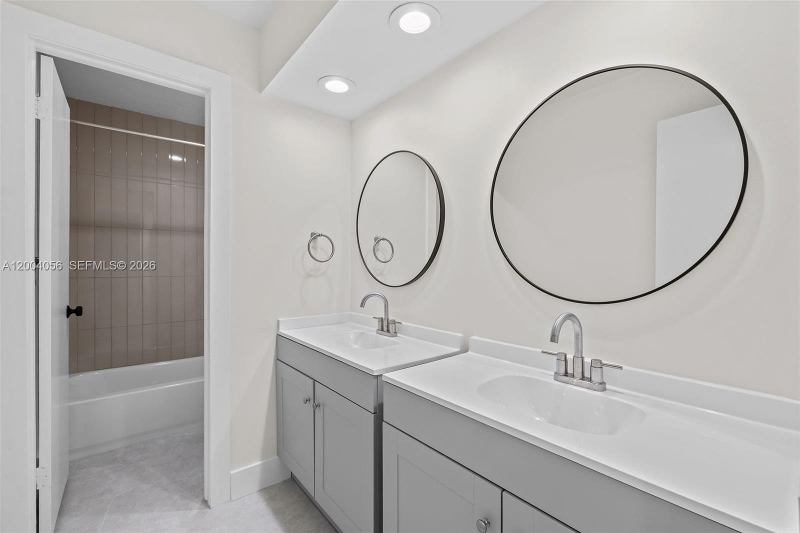 9547 Southwest 146th Place Miami, FL 33186 - Photo 31 of 40 a bathroom with a sink and a mirror