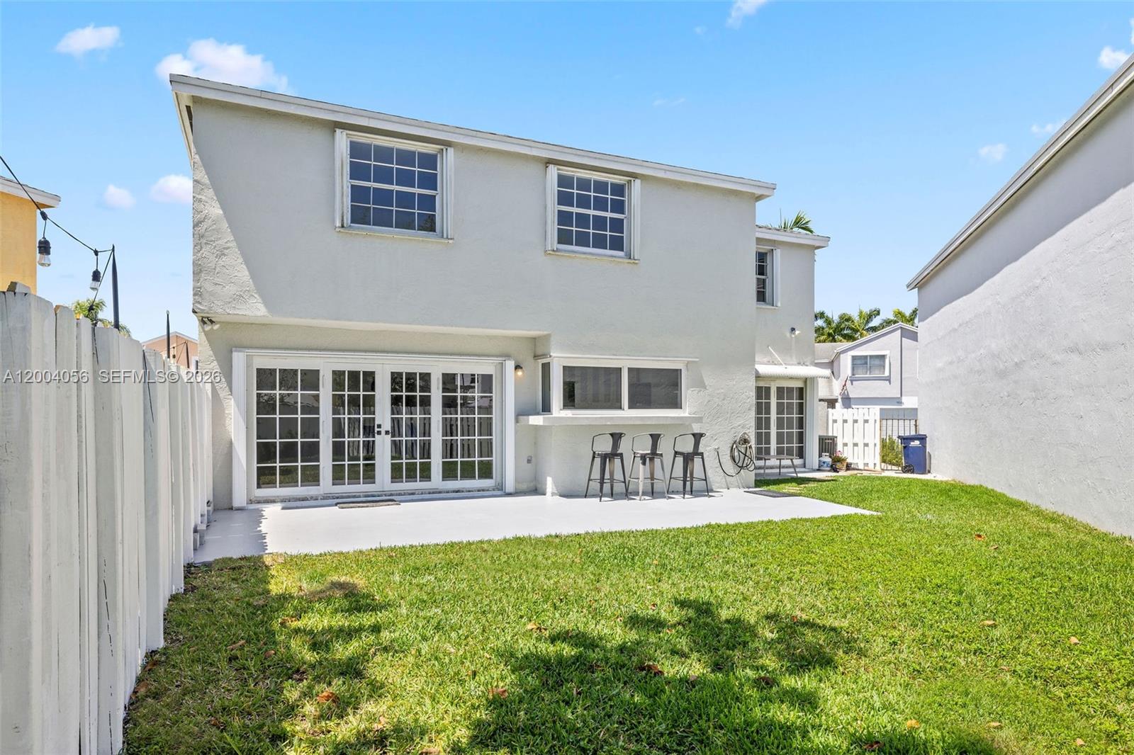 9547 Southwest 146th Place Miami, FL 33186 - Photo 35 of 40 a house view with a sitting space and garden