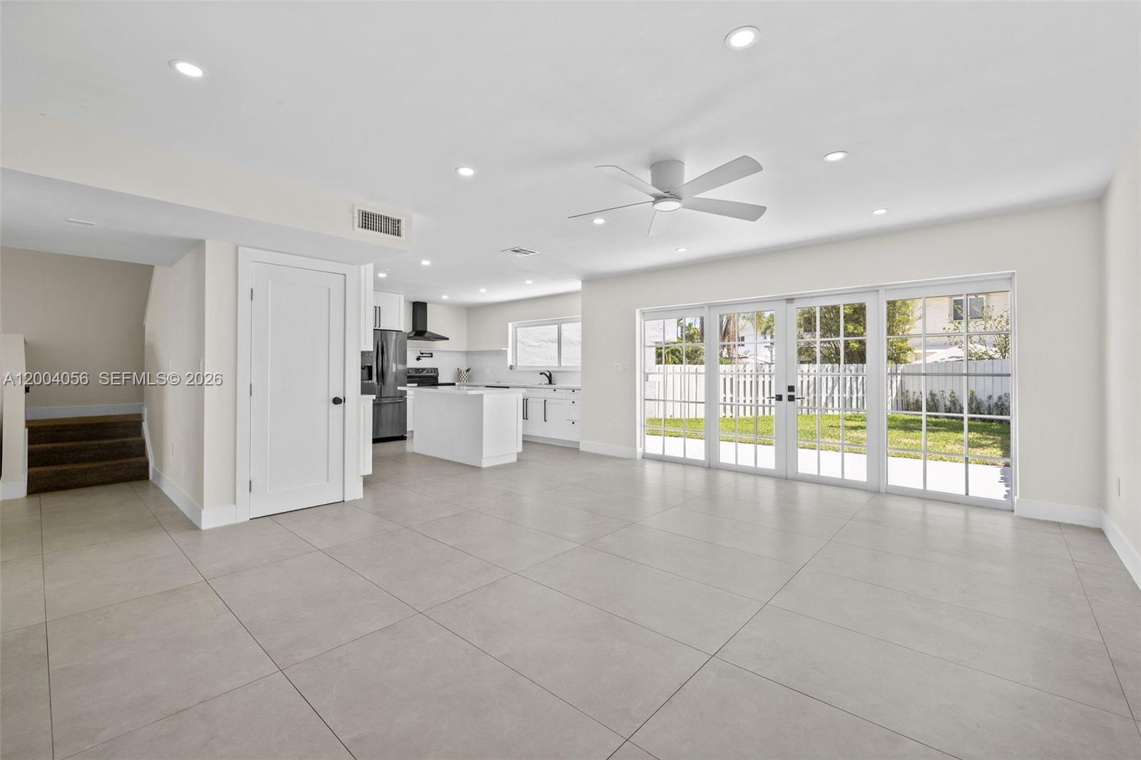 9547 Southwest 146th Place Miami, FL 33186 - Photo 8 of 40 a view of an empty room with a kitchen