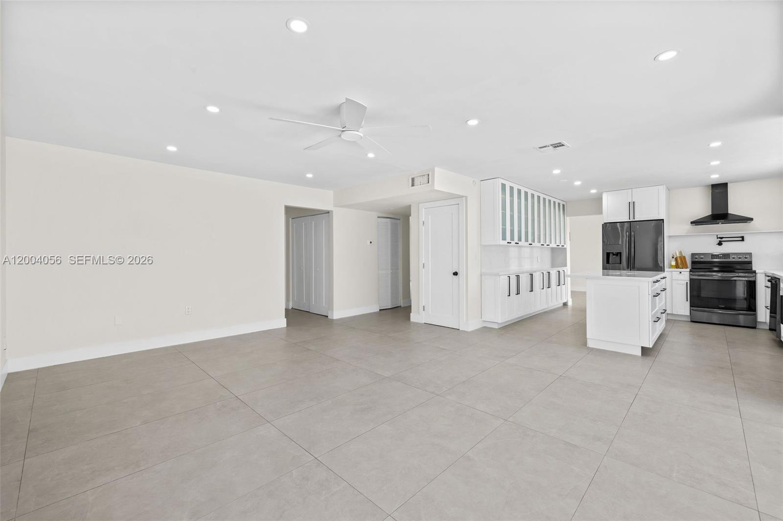 9547 Southwest 146th Place Miami, FL 33186 - Photo 10 of 40 a view of a kitchen with refrigerator and a microwave