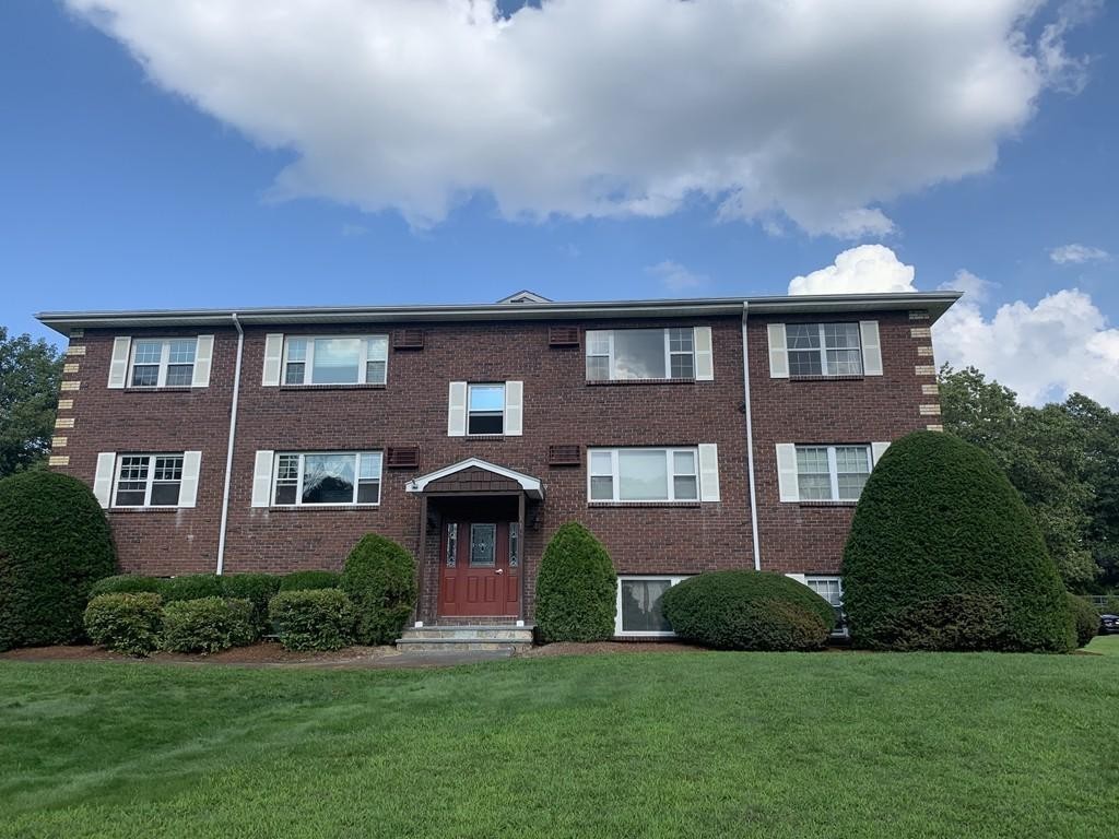 120 Parker Street, Unit 25 Acton, MA 01720 - Photo 11 of 11 a front view of a house with a yard