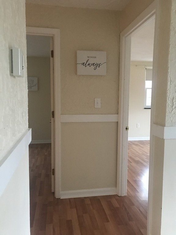120 Parker Street, Unit 25 Acton, MA 01720 - Photo 8 of 11 wooden floor in a empty room