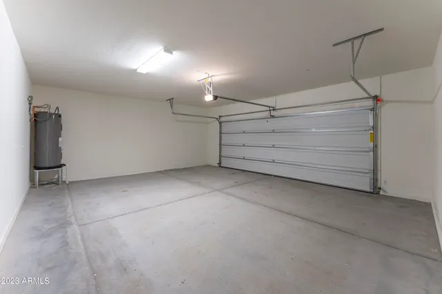 an empty room with closet and a bathroom