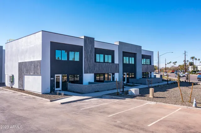 a view of a building with sitting area