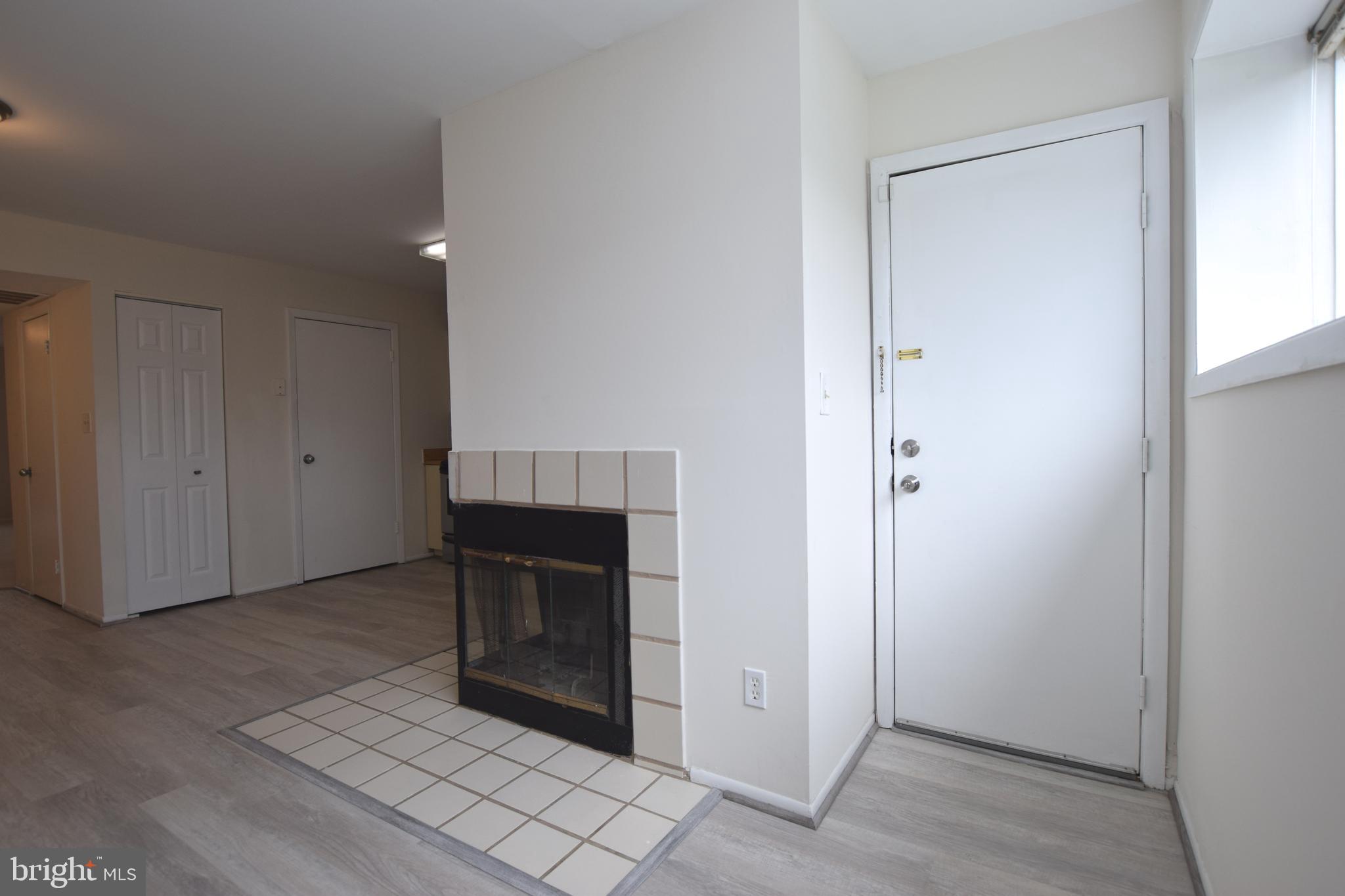6907 Jones View Drive, Unit 1B Baltimore, MD 21209 - Photo 12 of 25 Kitchen has Door to Rear Patio & Utility Closet