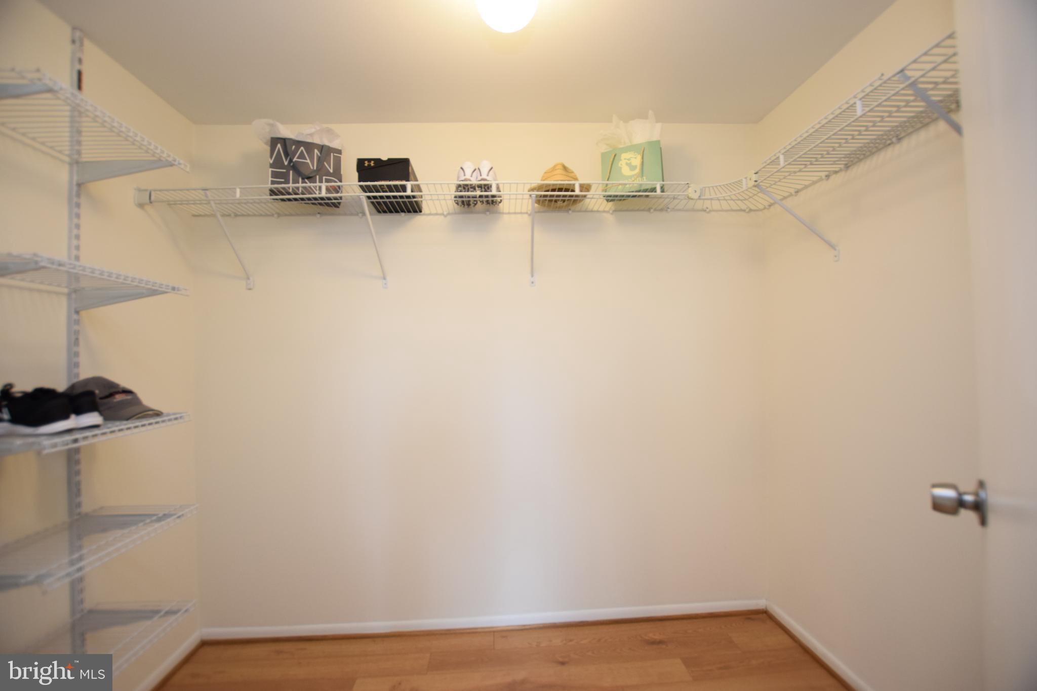 6907 Jones View Drive, Unit 1B Baltimore, MD 21209 - Photo 17 of 25 Large Walk-in Closet in Primary Bedroom