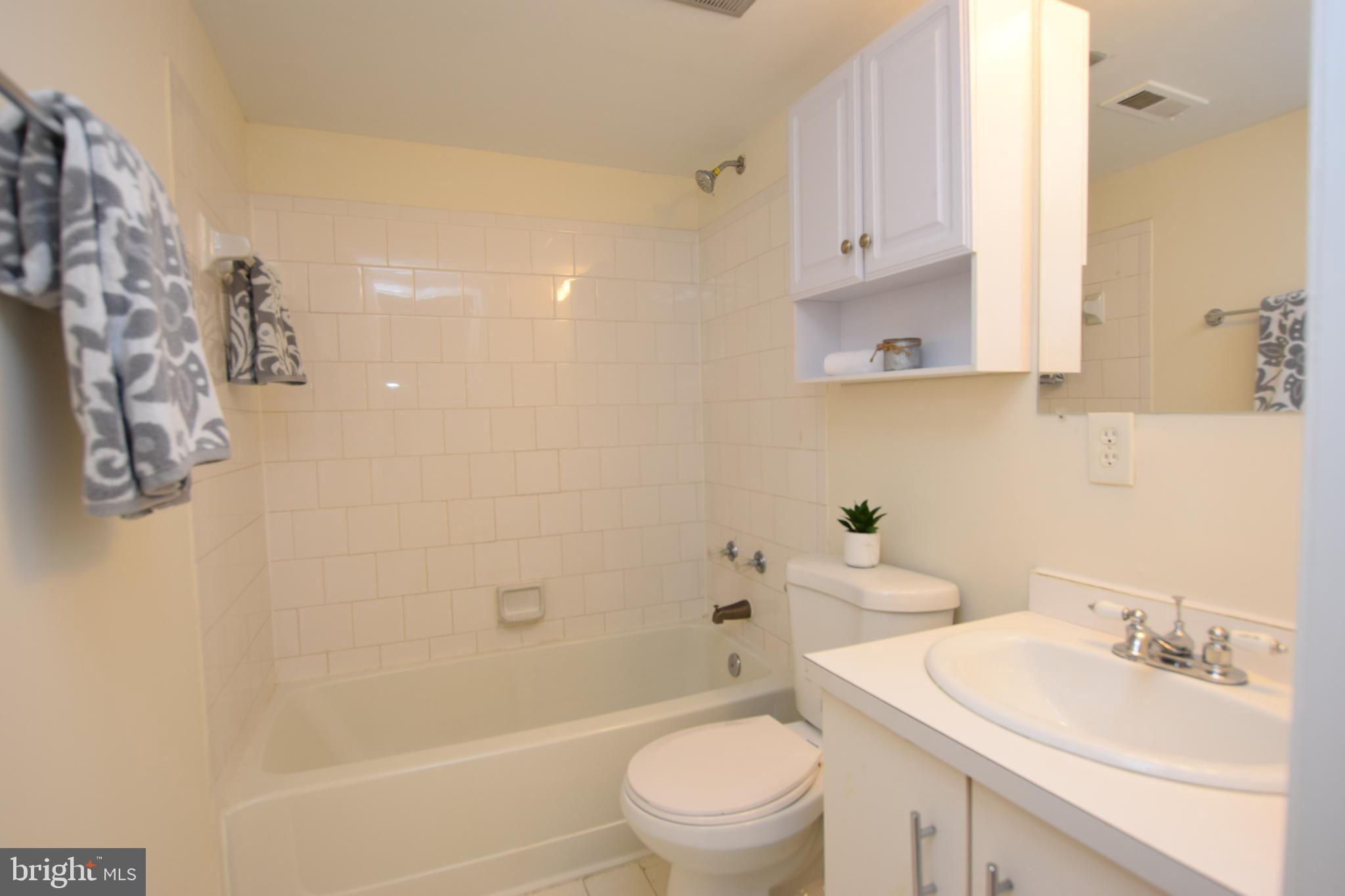 6907 Jones View Drive, Unit 1B Baltimore, MD 21209 - Photo 23 of 25 Ceramic Hall Bath