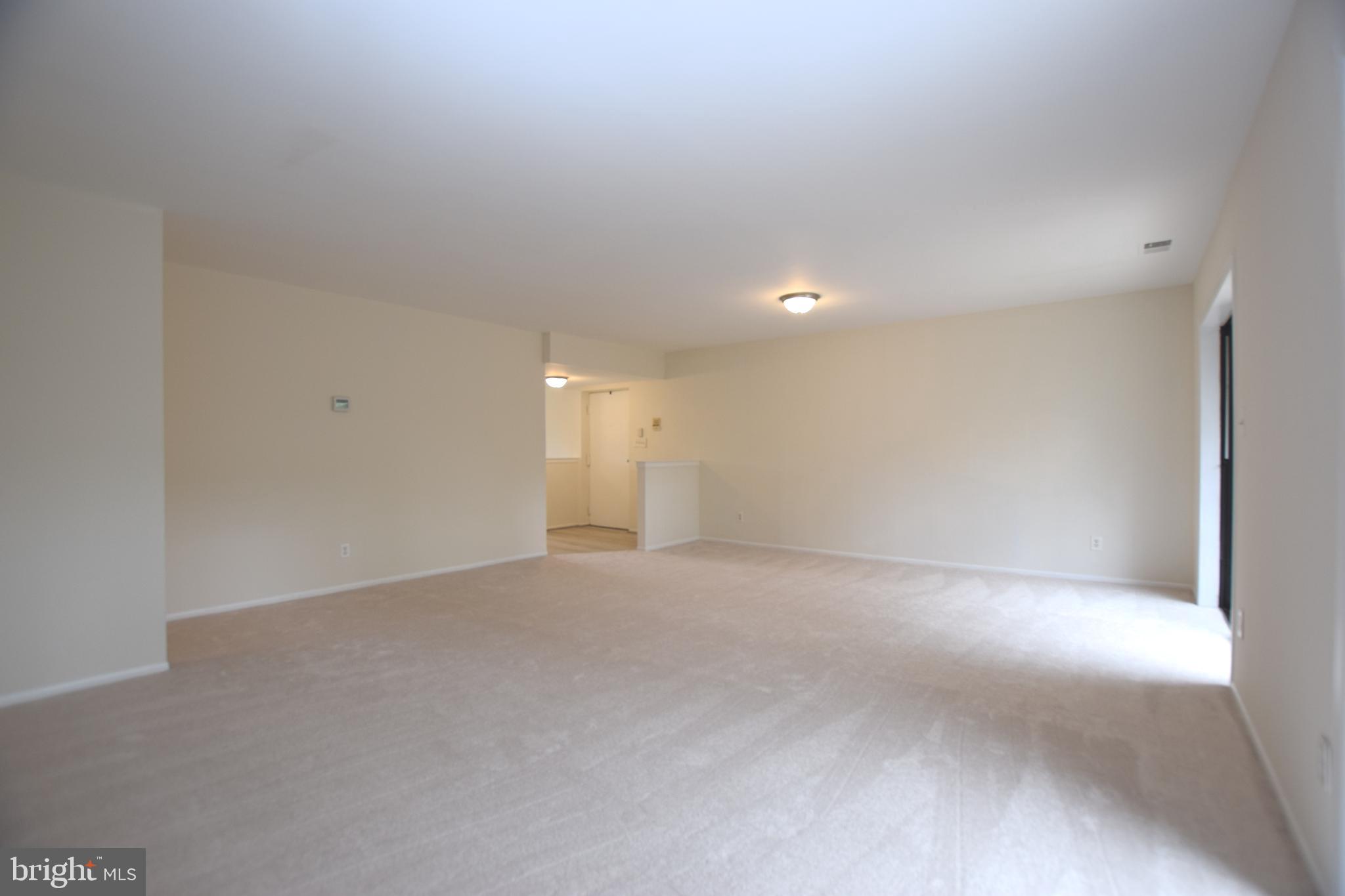 6907 Jones View Drive, Unit 1B Baltimore, MD 21209 - Photo 4 of 25 Living Room off Entryway