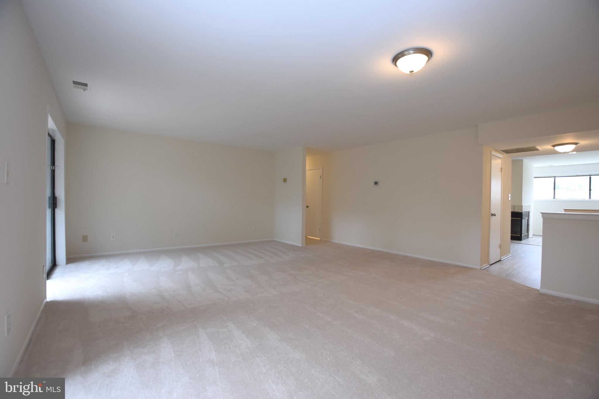 6907 Jones View Drive, Unit 1B Baltimore, MD 21209 - Photo 7 of 25 Living Room is Very Spacious & Opens to Kitchen