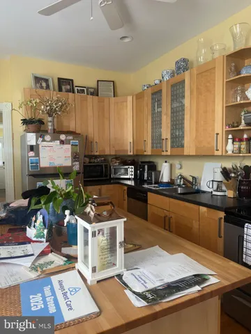 a kitchen with stainless steel appliances granite countertop a stove a sink and a granite counter tops
