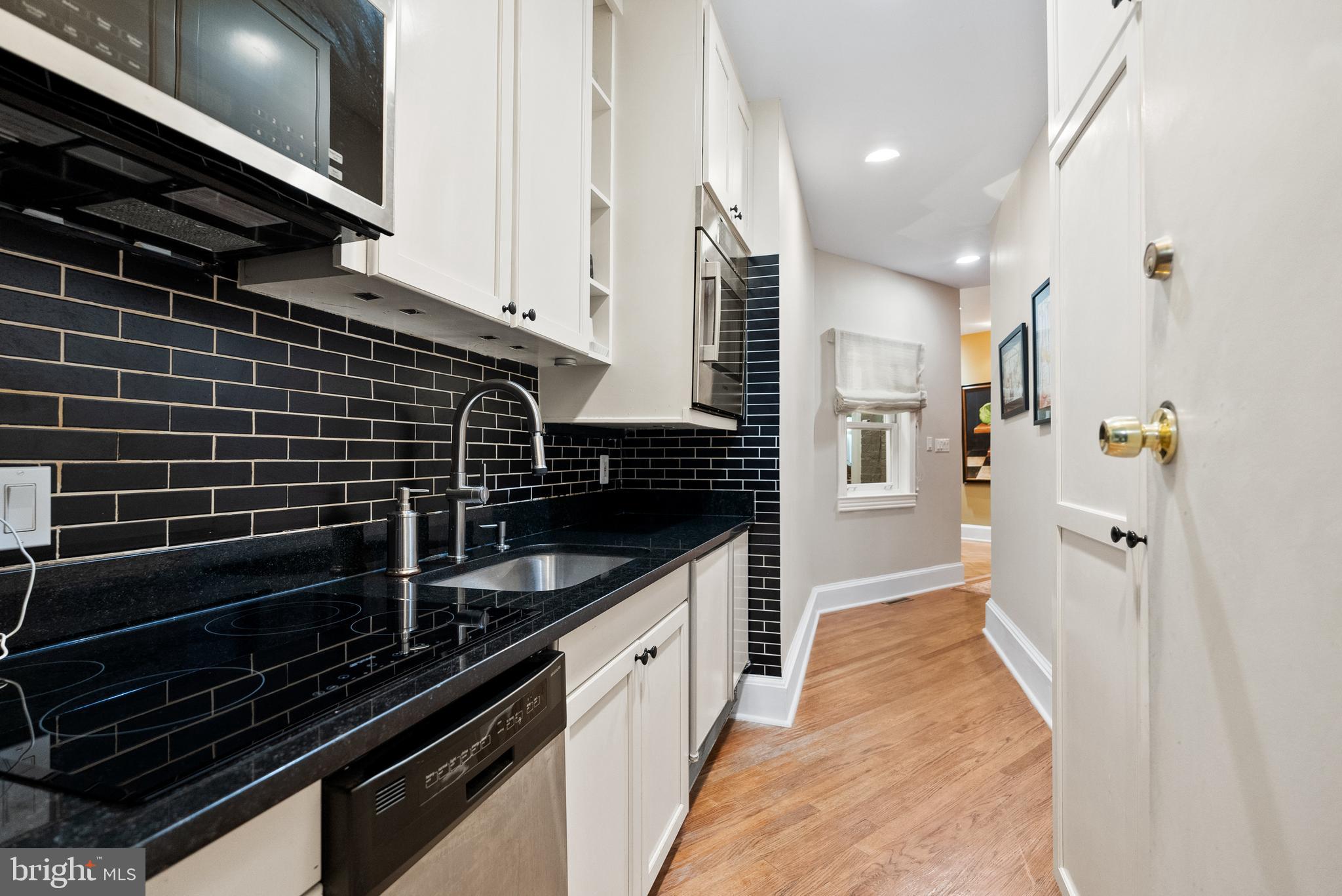 2131 S Street Northwest Washington, DC 20008 - Photo 11 of 29 a kitchen with a sink and cabinets