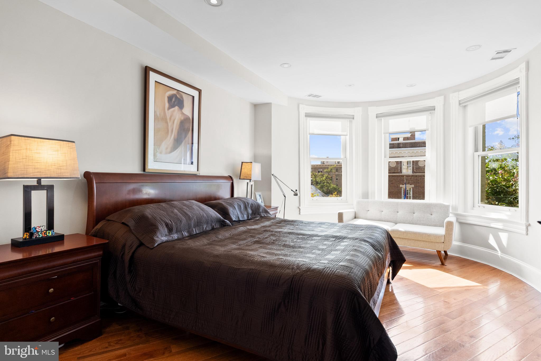 2131 S Street Northwest Washington, DC 20008 - Photo 17 of 29 a bedroom with a bed and a large window