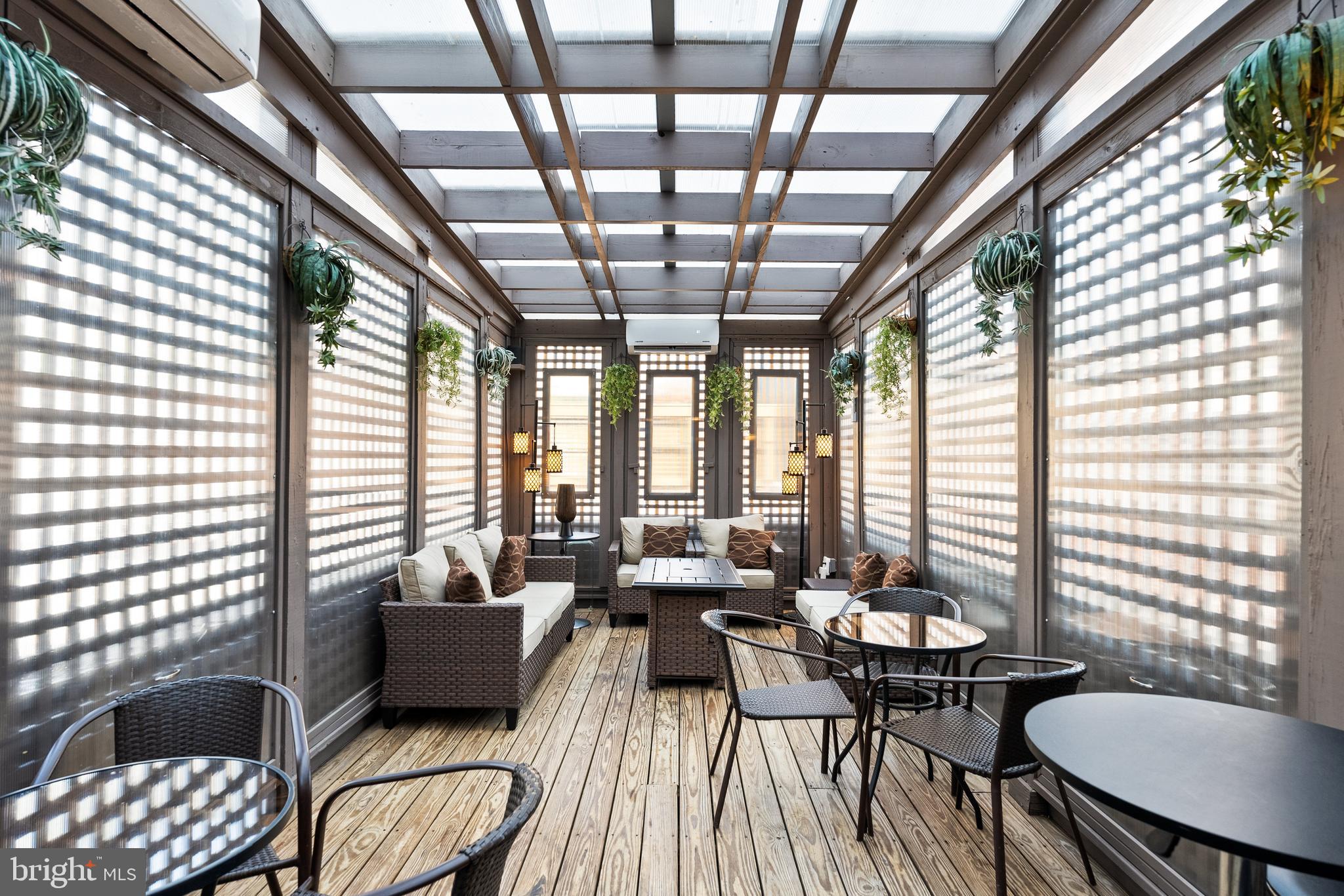 2131 S Street Northwest Washington, DC 20008 - Photo 20 of 29 a living room with furniture and a large window